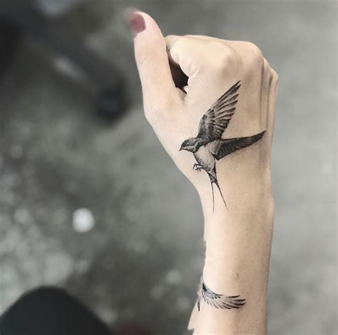 bird tattoo on hand